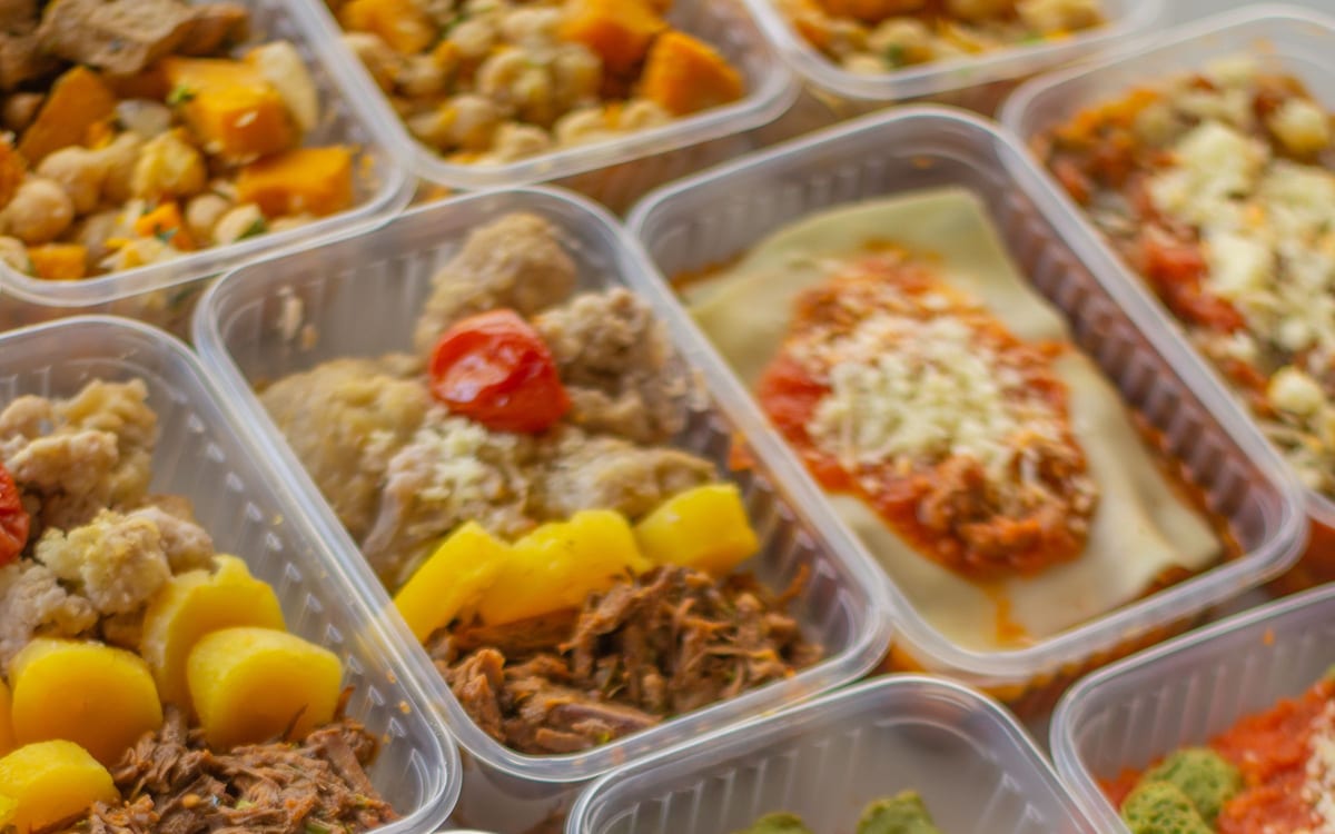 Colorful prepared meal boxes with vegetables, grains, and protein