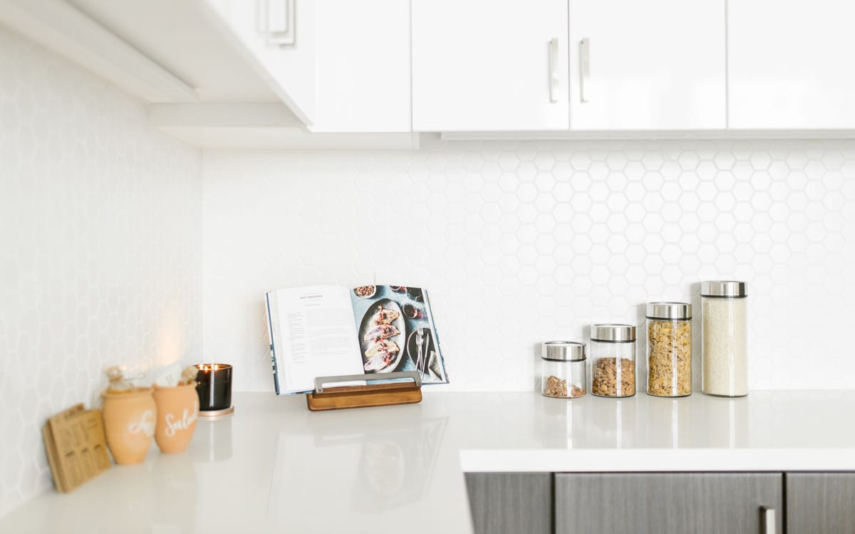 Organized pantry shelf with glass jars and containers
